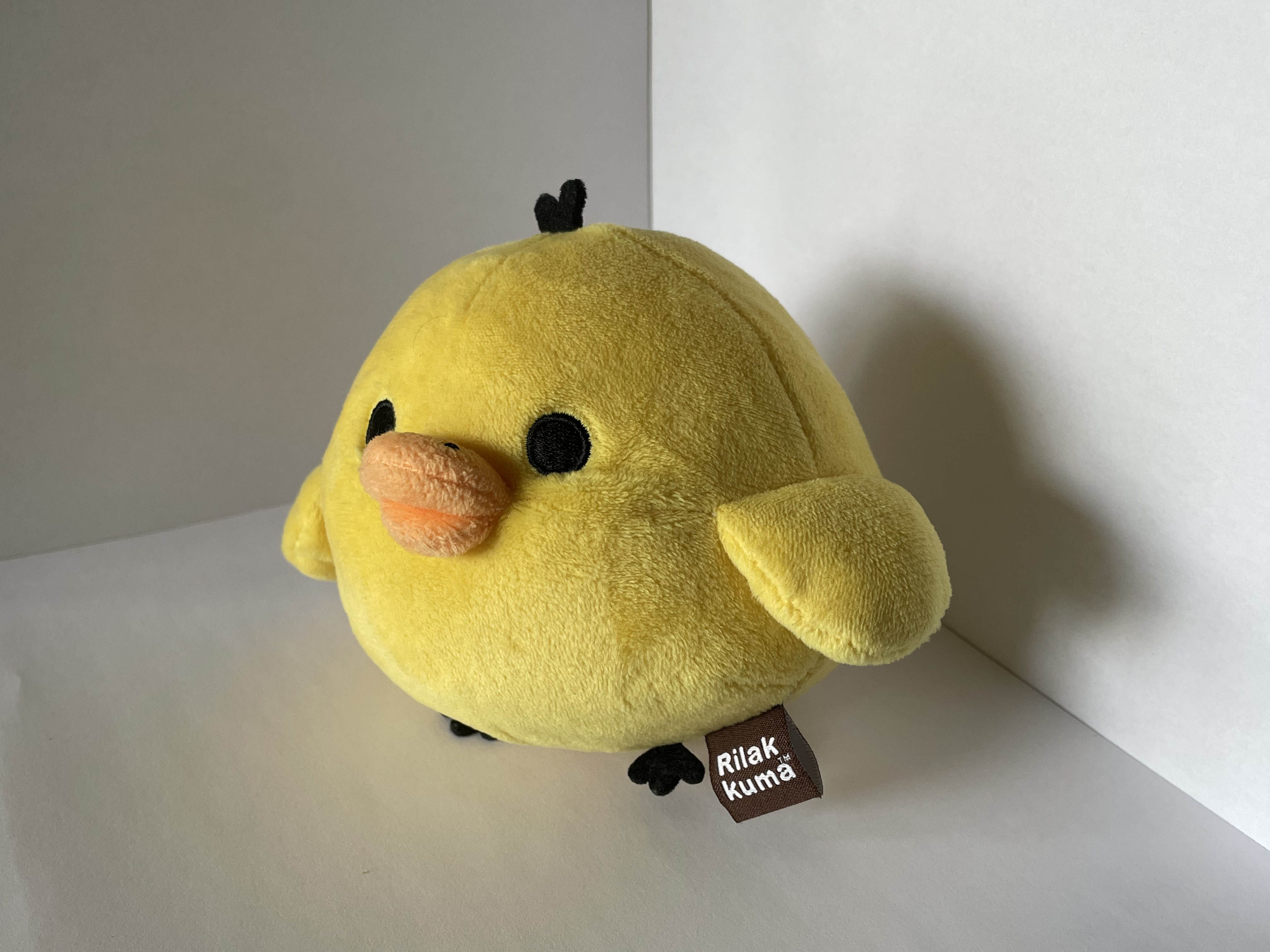 Another side view of the chicken plushie.