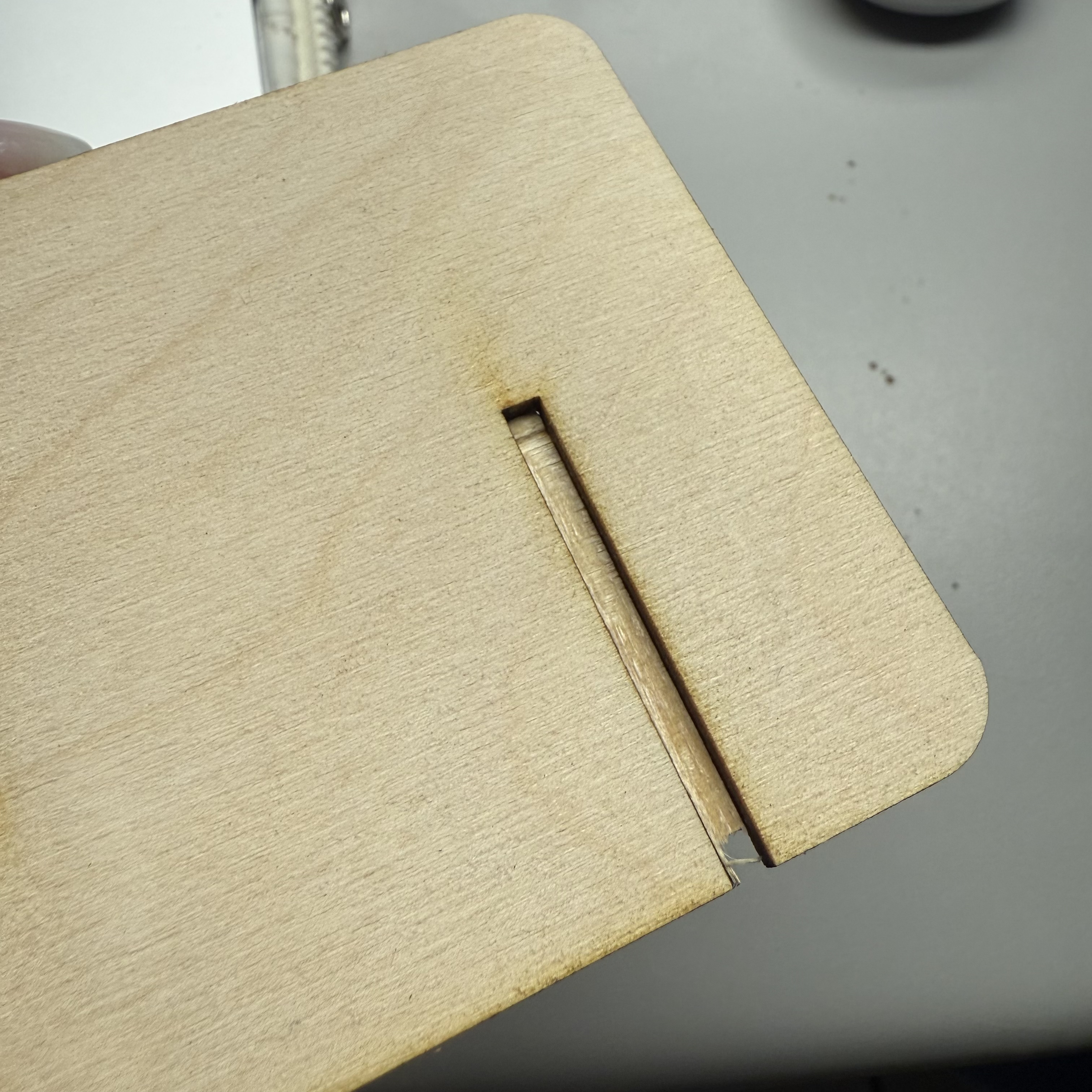 There was a cutting error on one of the back supports of the phone stands. The thin piece would not come off because it wasn't cut through all the way.