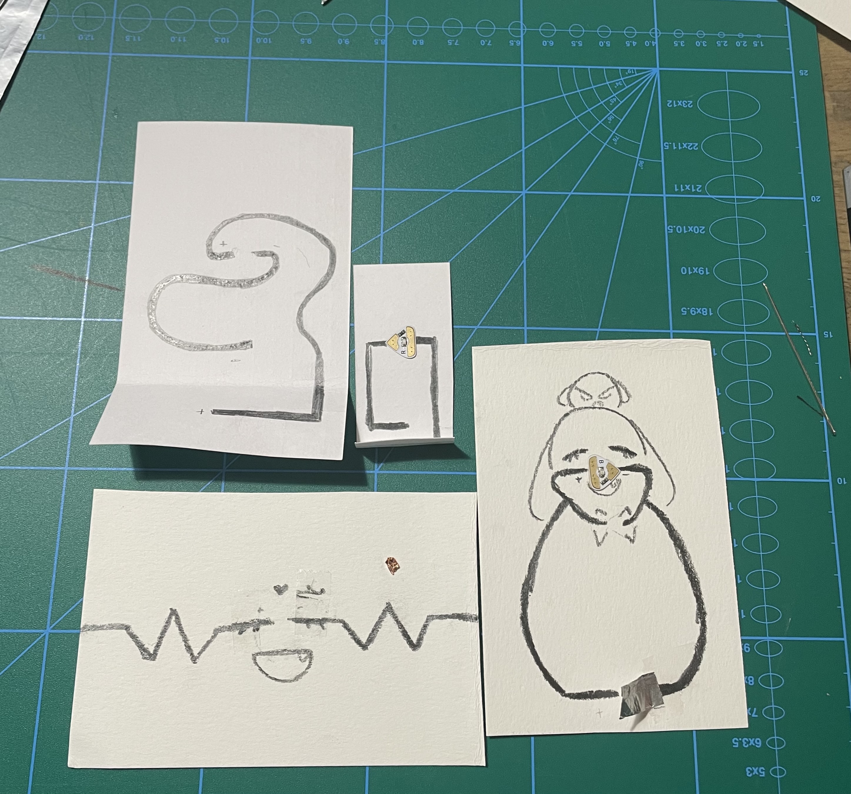 These are some of the several attemps I tried for a graphite circuit. The light wasn't lighting up, so it's either the graphite isn't drawn on well enough or there's not enough power.